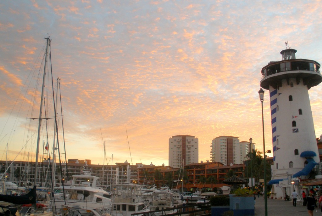 Sunset in Marina Vallarta with El Faro Light house bar featured